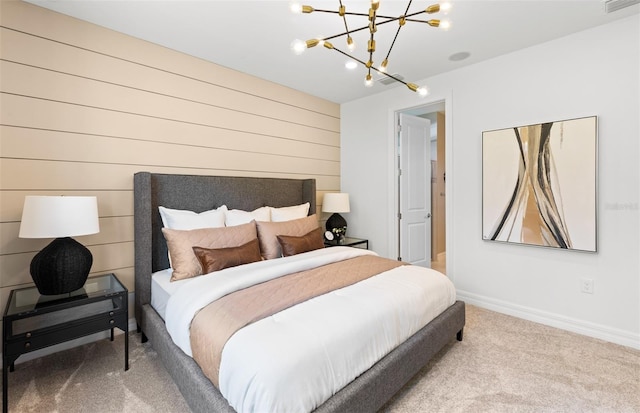carpeted bedroom with visible vents, baseboards, and an inviting chandelier
