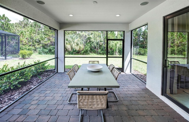 sunroom / solarium with outdoor dining area