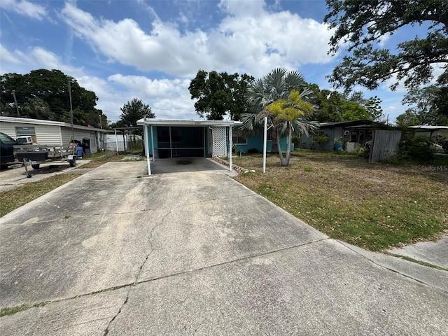 6047 67th Ave N, Pinellas Park, FL 33781 - view of front facade with a carport and concrete driveway