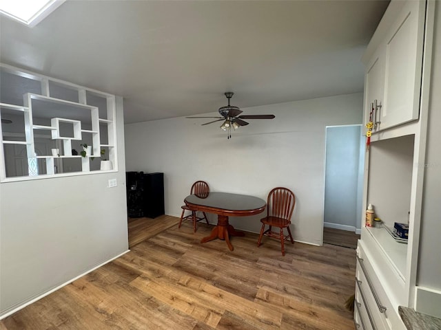 6047 67th Ave N, Pinellas Park, FL 33781 - dining area featuring a ceiling fan and wood finished floors