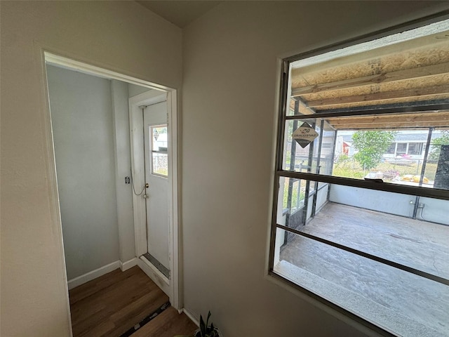 6047 67th Ave N, Pinellas Park, FL 33781 - doorway to outside with plenty of natural light, baseboards, and wood finished floors