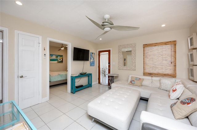 living area with light tile patterned floors, ceiling fan, and recessed lighting