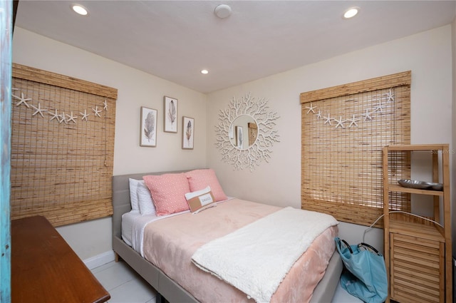 bedroom featuring recessed lighting, baseboards, and light tile patterned floors