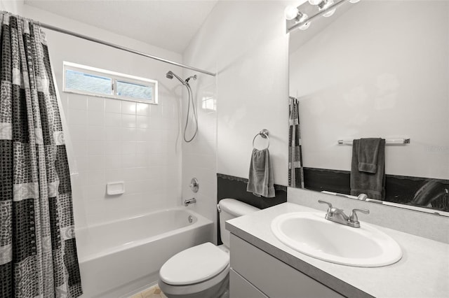 bathroom with vanity, shower / bath combo with shower curtain, and toilet