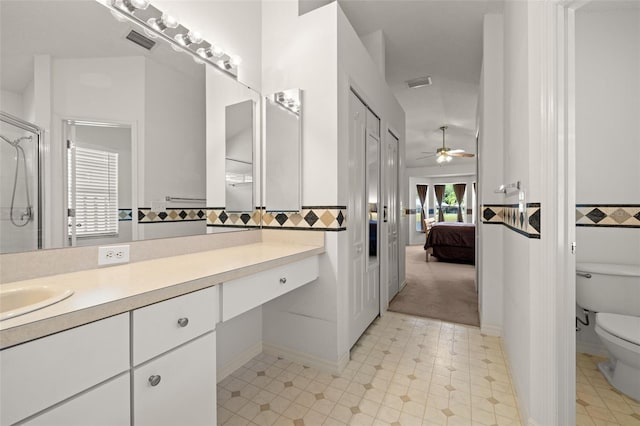 full bathroom with visible vents, an enclosed shower, toilet, and vanity