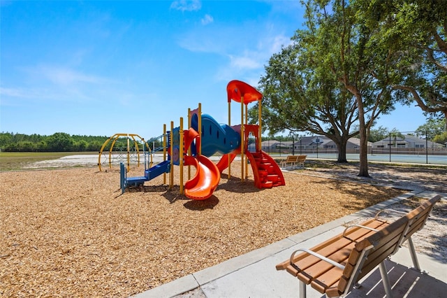 community jungle gym featuring fence