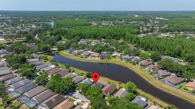 birds eye view of property with a residential view and a water view