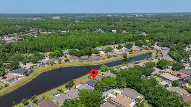drone / aerial view featuring a water view and a residential view