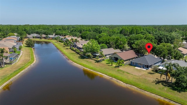 bird's eye view with a residential view, a water view, and a forest view