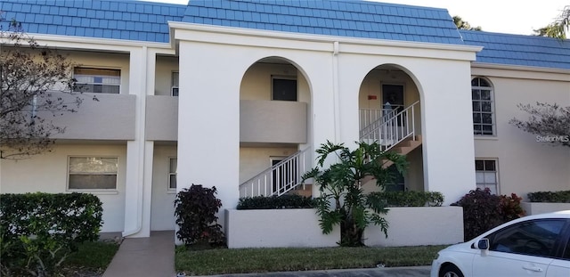 1975 W Bay Dr Unit 207, Largo, FL 33770 - view of property with stairway