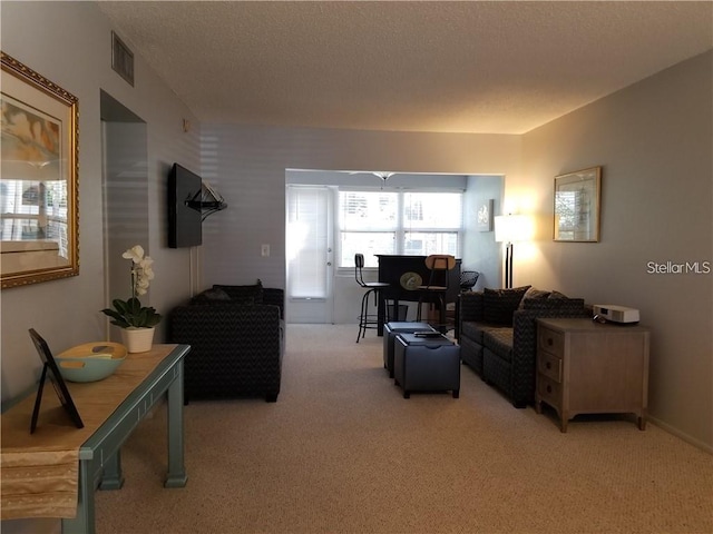 1975 W Bay Dr Unit 207, Largo, FL 33770 - living area with light carpet and visible vents