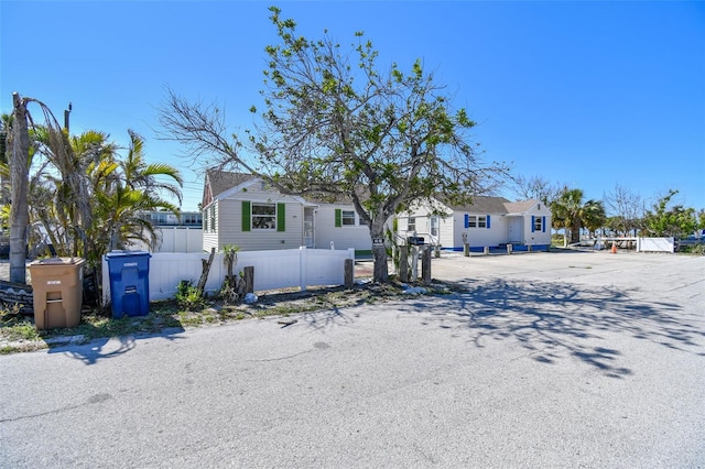 103 146th Ave E, Madeira Beach, FL 33708 - view of front of house featuring fence private yard