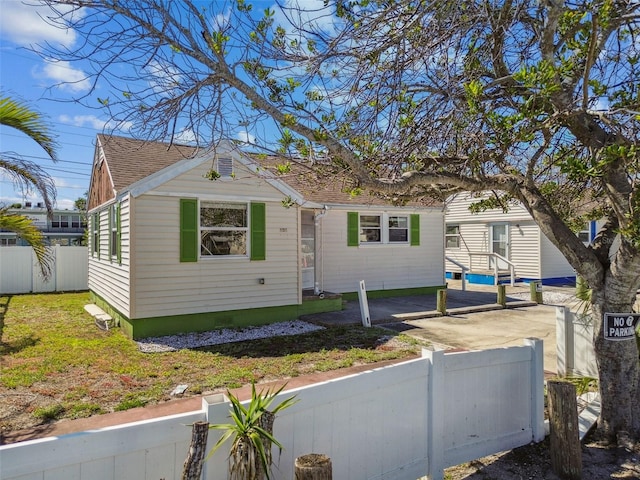 103 146th Ave E, Madeira Beach, FL 33708 - bungalow-style house featuring fence private yard and roof with shingles