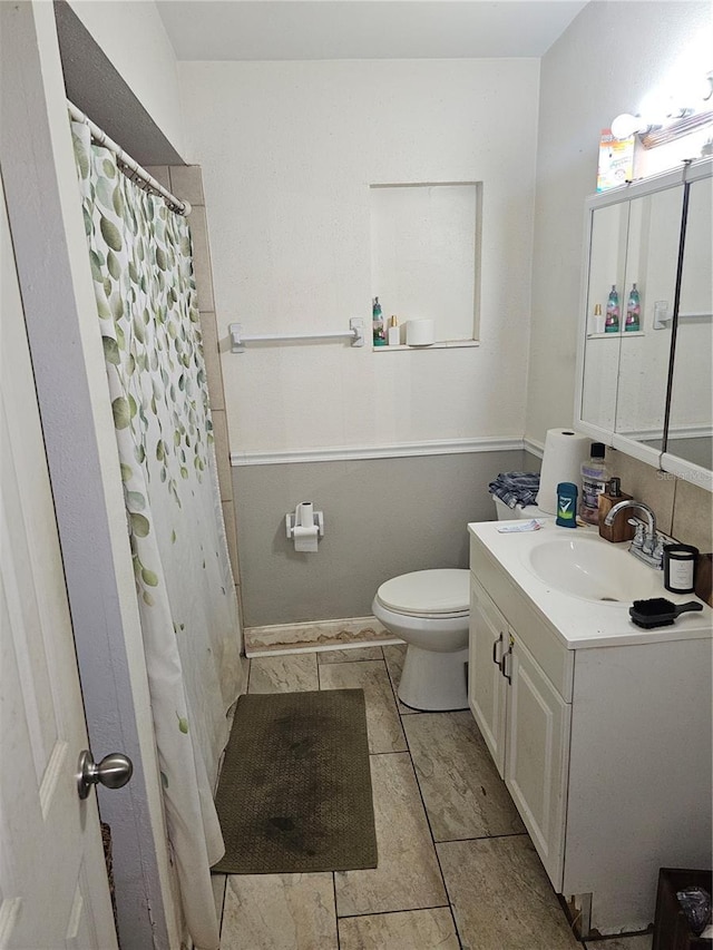 3714 E Ellicott St, Tampa, FL 33610 - bathroom with vanity, a shower with shower curtain, and toilet