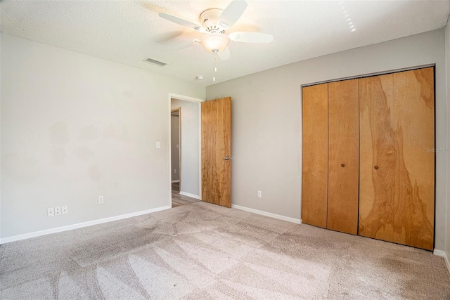12129 Meadow Ln, San Antonio, FL 33576 - unfurnished bedroom featuring baseboards, visible vents, carpet, a ceiling fan, and a closet
