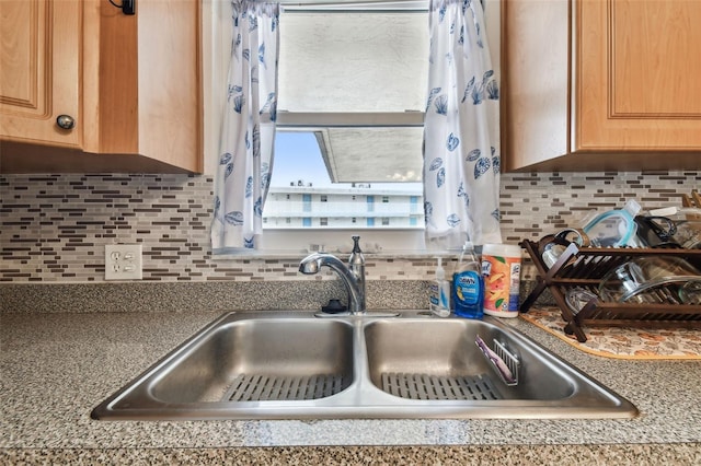 9945 47th Ave N Unit 208, Saint Petersburg, FL 33708 - kitchen featuring a sink, decorative backsplash, and light brown cabinets