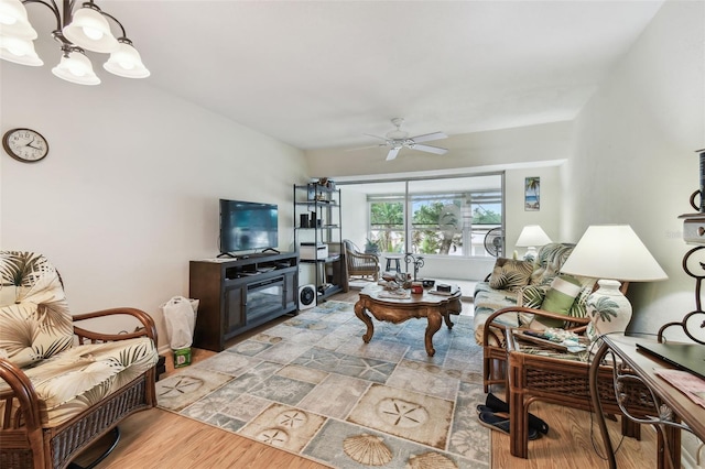 9945 47th Ave N Unit 208, Saint Petersburg, FL 33708 - living room featuring wood finished floors, ceiling fan, and a chandelier