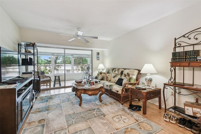 9945 47th Ave N Unit 208, Saint Petersburg, FL 33708 - living area featuring ceiling fan, wood finished floors, and baseboards