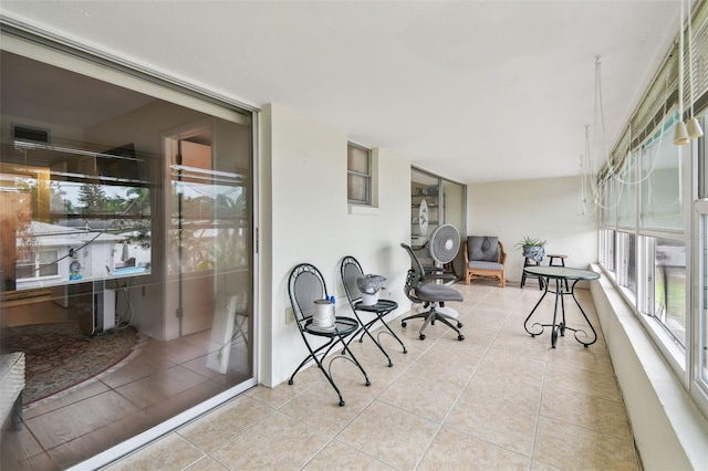 9945 47th Ave N Unit 208, Saint Petersburg, FL 33708 - sunroom featuring tile patterned flooring