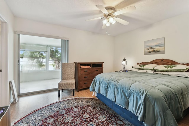 9945 47th Ave N Unit 208, Saint Petersburg, FL 33708 - bedroom with wood finished floors and ceiling fan