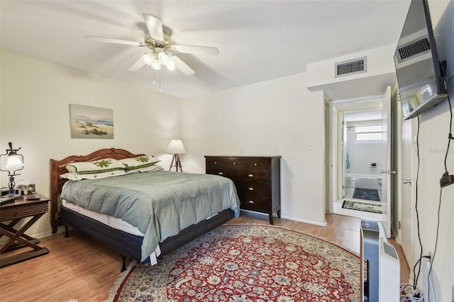 9945 47th Ave N Unit 208, Saint Petersburg, FL 33708 - bedroom featuring wood finished floors, a ceiling fan, and baseboards