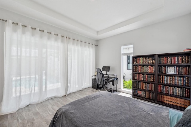 5917 Cat Claw Ln, Bradenton, FL 34210 - bedroom featuring wood finished floors and a raised ceiling
