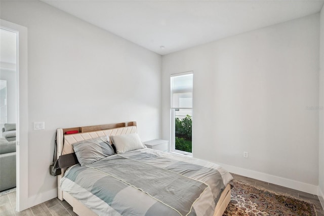 5917 Cat Claw Ln, Bradenton, FL 34210 - bedroom with baseboards and light wood-type flooring