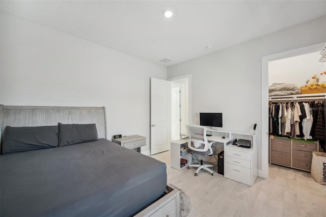 5917 Cat Claw Ln, Bradenton, FL 34210 - bedroom with a closet, a spacious closet, light wood finished floors, and visible vents