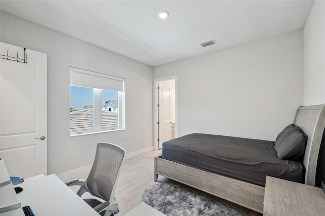 5917 Cat Claw Ln, Bradenton, FL 34210 - bedroom featuring wood finished floors, visible vents, and baseboards