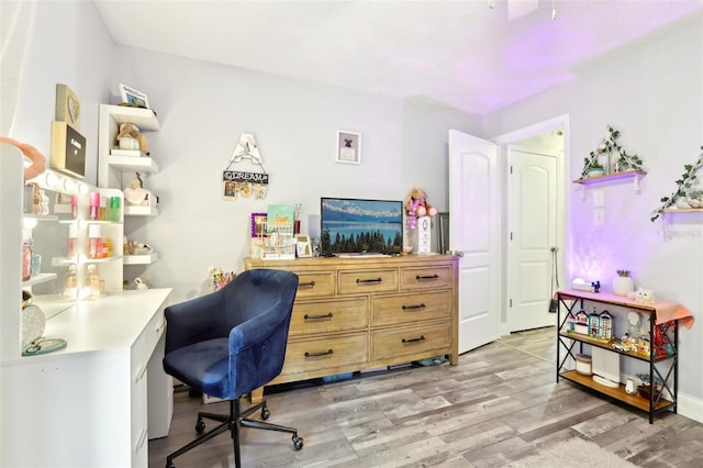 office with light wood-type flooring