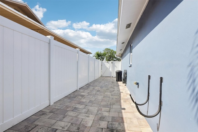 view of patio / terrace with fence and a gate
