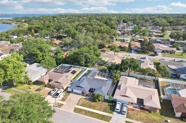 drone / aerial view with a residential view and a water view
