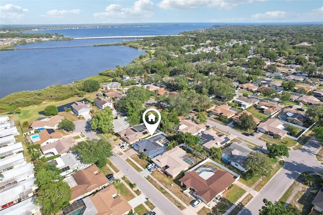 bird's eye view with a residential view and a water view