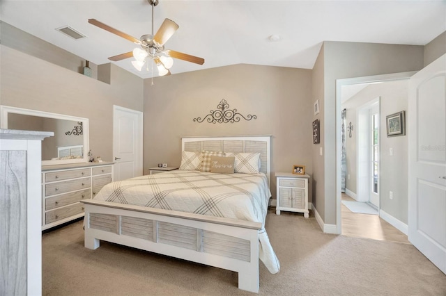 bedroom with vaulted ceiling, baseboards, visible vents, a ceiling fan, and carpet floors