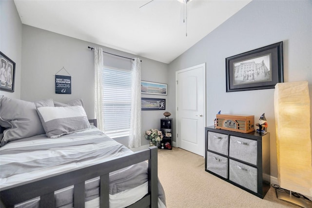carpeted bedroom with lofted ceiling