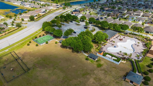 bird's eye view featuring a residential view and a water view