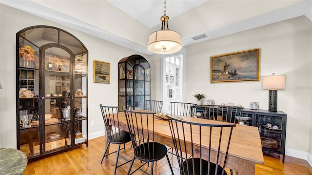 10101 Bryant Rd, Lithia, FL 33547 - dining space featuring light wood-style floors and arched walkways