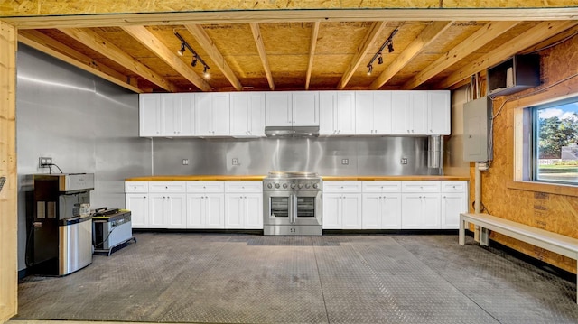 10101 Bryant Rd, Lithia, FL 33547 - kitchen with double oven range, track lighting, wood counters, electric panel, and dark colored carpet