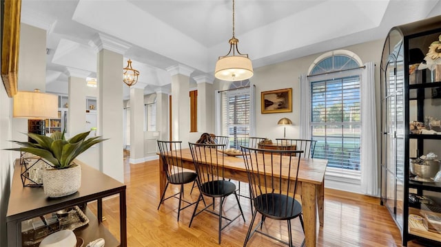 10101 Bryant Rd, Lithia, FL 33547 - dining space featuring decorative columns, light wood-style floors, and crown molding