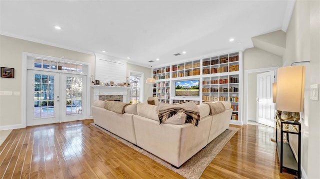 10101 Bryant Rd, Lithia, FL 33547 - living room with hardwood / wood-style floors, plenty of natural light, built in features, recessed lighting, and crown molding