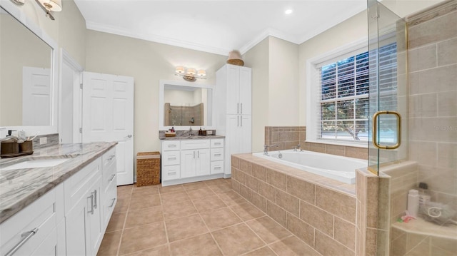10101 Bryant Rd, Lithia, FL 33547 - bathroom with ornamental molding, two vanities, tile patterned flooring, a stall shower, and a garden tub