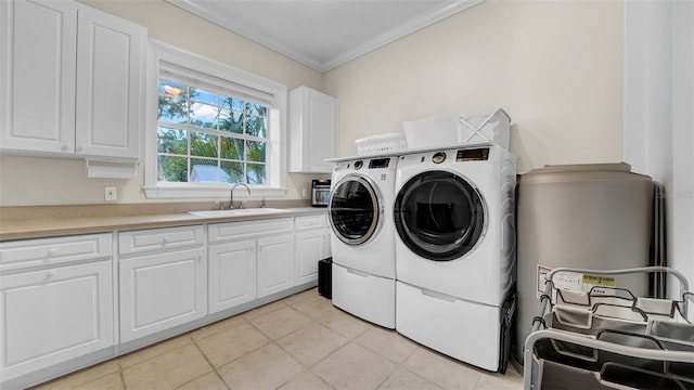 10101 Bryant Rd, Lithia, FL 33547 - laundry room with separate washer and dryer, cabinet space, crown molding, and light tile patterned flooring