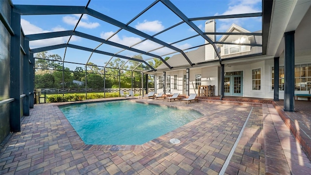 10101 Bryant Rd, Lithia, FL 33547 - swimming pool with a patio, french doors, and a lanai