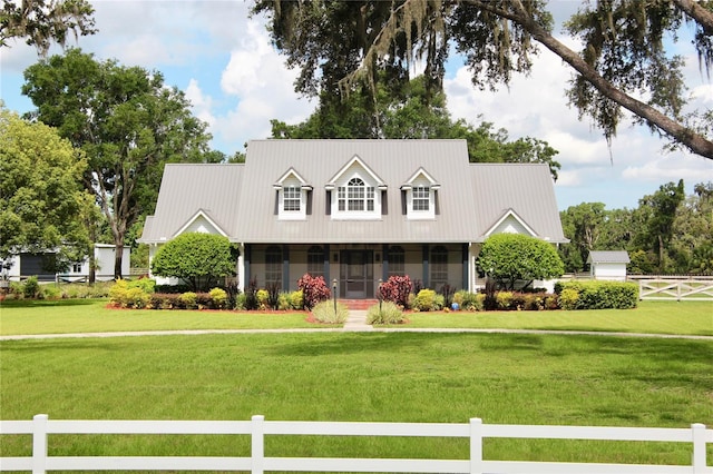 10101 Bryant Rd, Lithia, FL 33547 - cape cod home with a sunroom and a metal roof