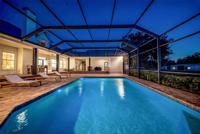 10101 Bryant Rd, Lithia, FL 33547 - pool at twilight featuring an outdoor pool, a patio, and a lanai