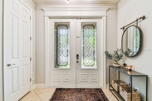 entryway featuring tile patterned floors and baseboards