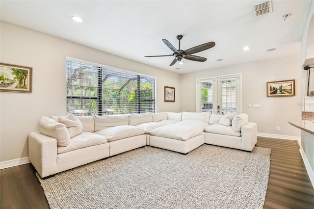 living room with recessed lighting, a ceiling fan, visible vents, baseboards, and wood finished floors