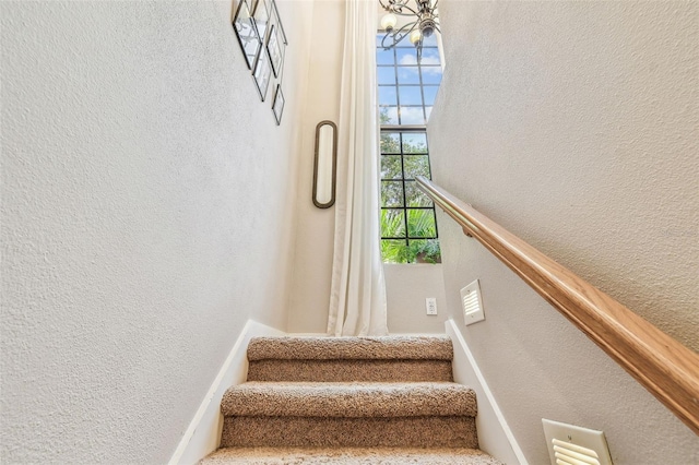 staircase with a textured wall