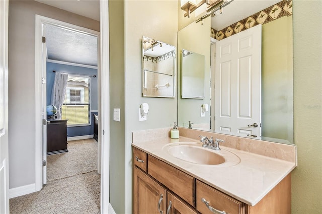 bathroom featuring vanity and baseboards