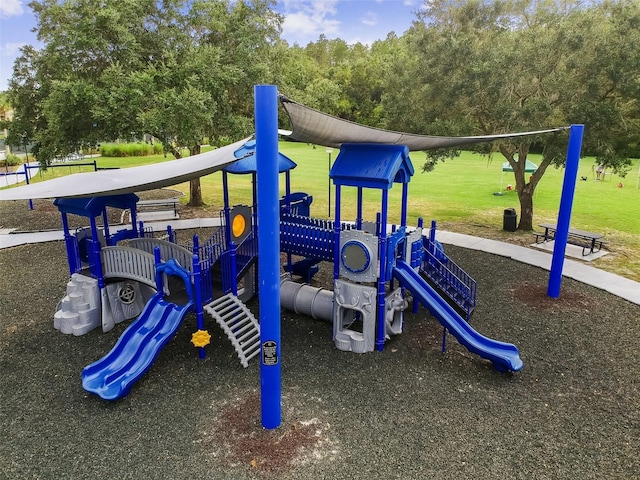 communal playground featuring a lawn